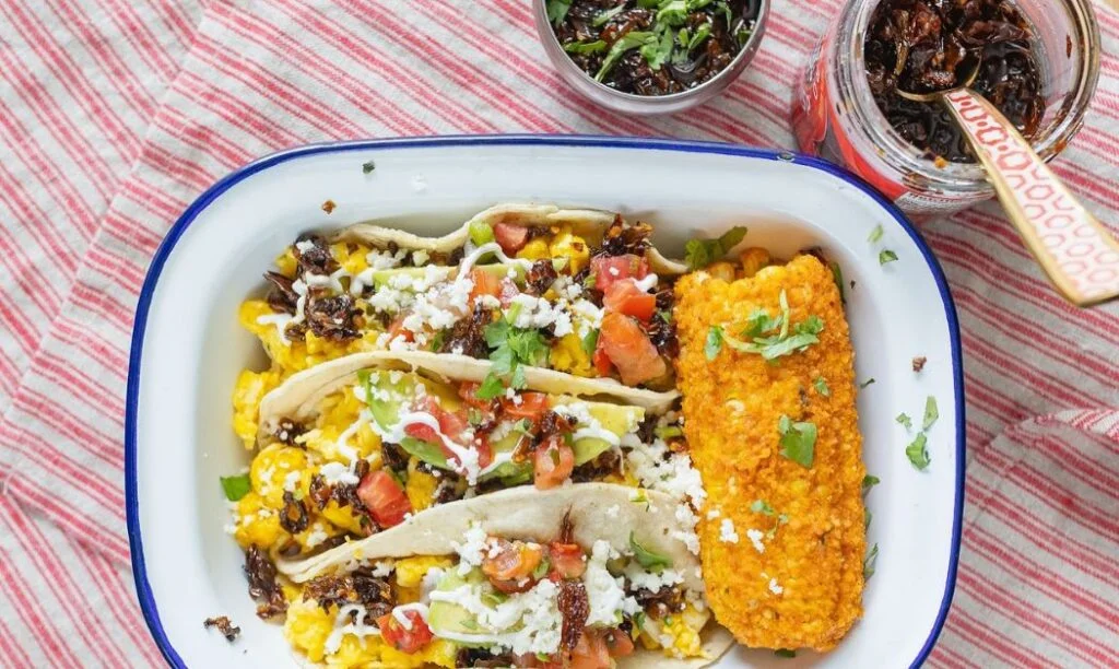 Three tacos with a site of corn on the cob, a dish from Katalina's in Columbus OH