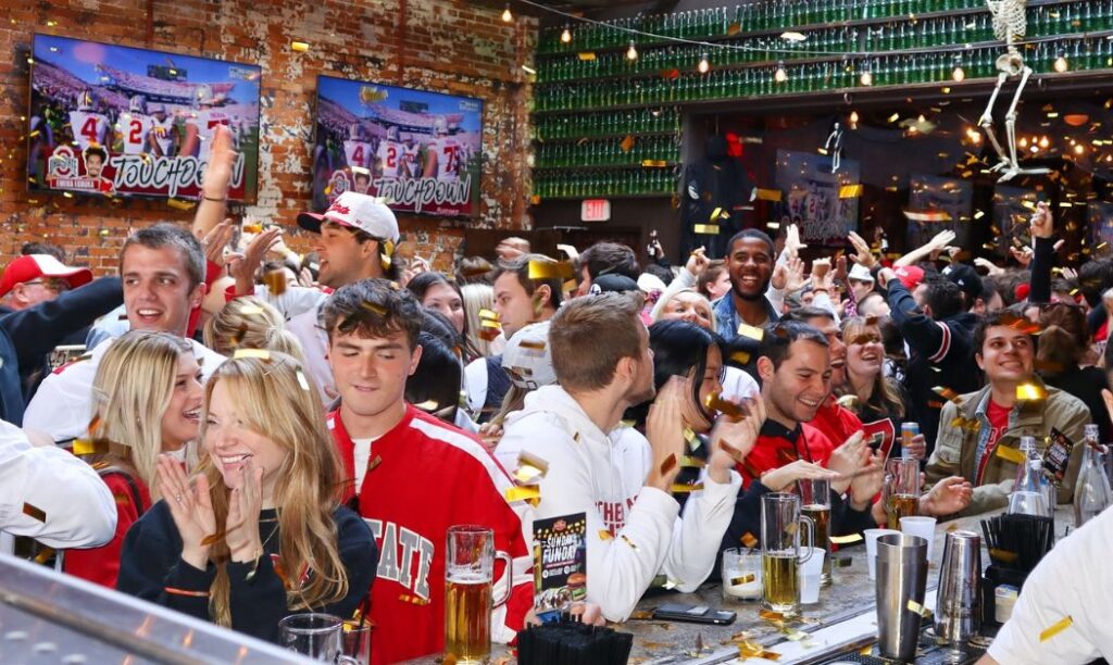 Patrons of the Short North Pint House celebrate an Ohio State touchdown vs. Penn State