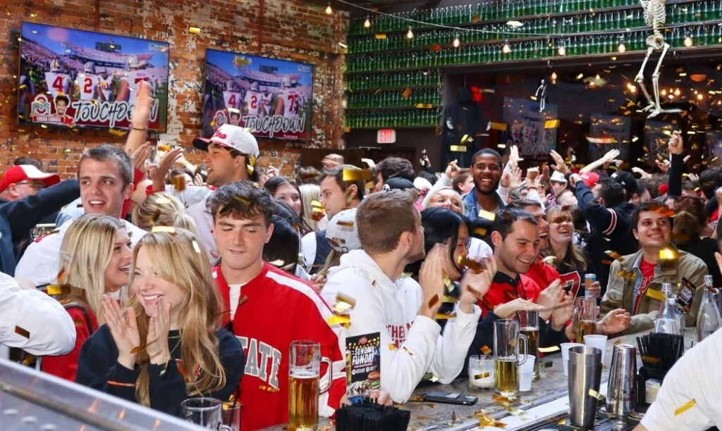 Patrons of the Short North Pint House celebrate an Ohio State touchdown vs. Penn State