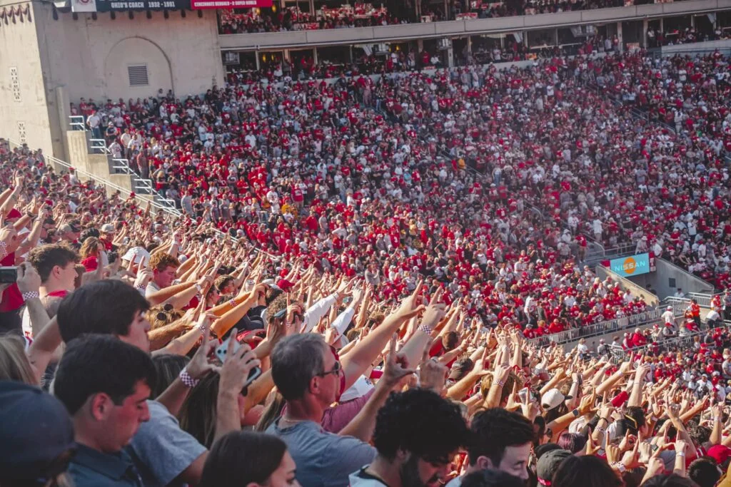 Ohio State fans in the South Stands at Ohio Stadium holding up the field goal uprights during an Ohio State field goal attempt