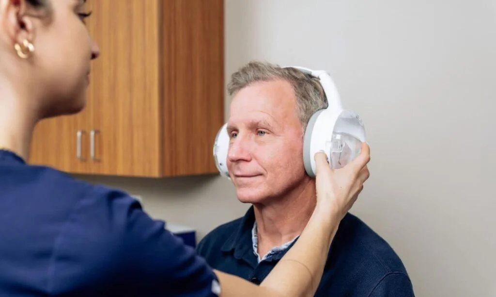 OtoSet clinician begins the satisfying cleaning cycle on a patient.