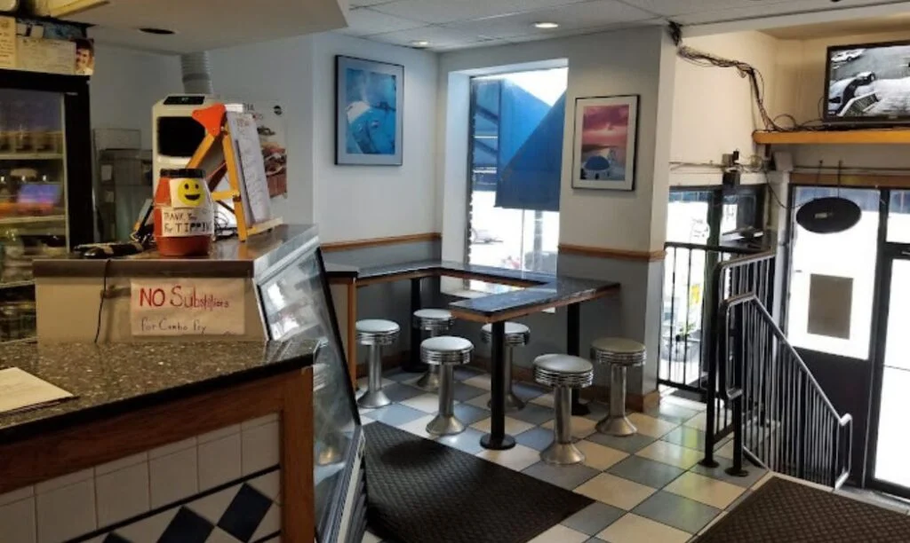 Photo of Apollo's Greek Restaurant's front seating and staircase down to High Street