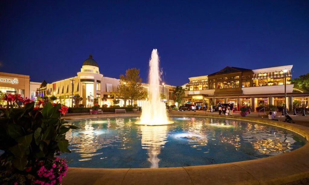 The fountain at Easton Town Center with outlet stores in the background.