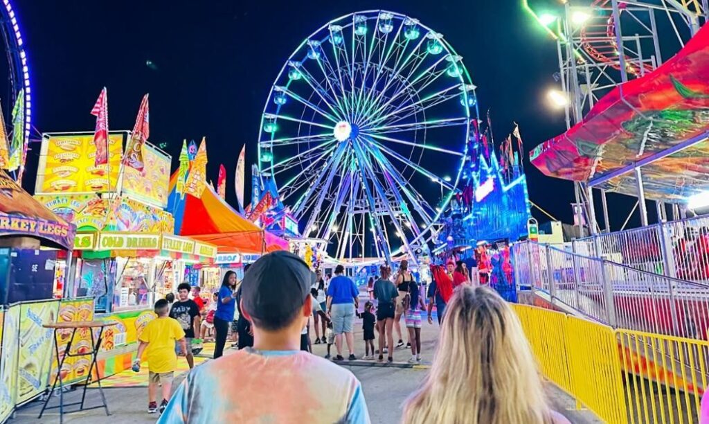 The Ohio State Fair at night, lit up in bright and colorful lights. 