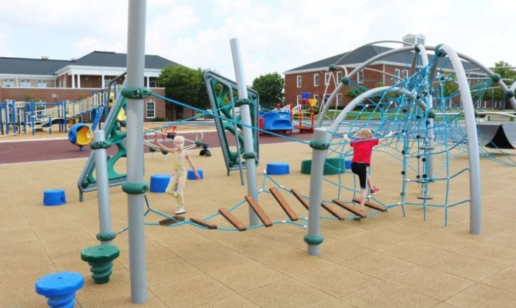 Kids enjoying playground equipment at New Albany-Plain Local Schools' Playground