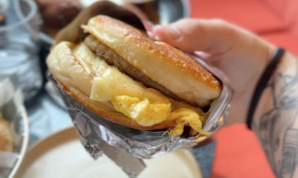 Homemade English muffin breakfast sandwich with egg and cheese at Mercury Diner