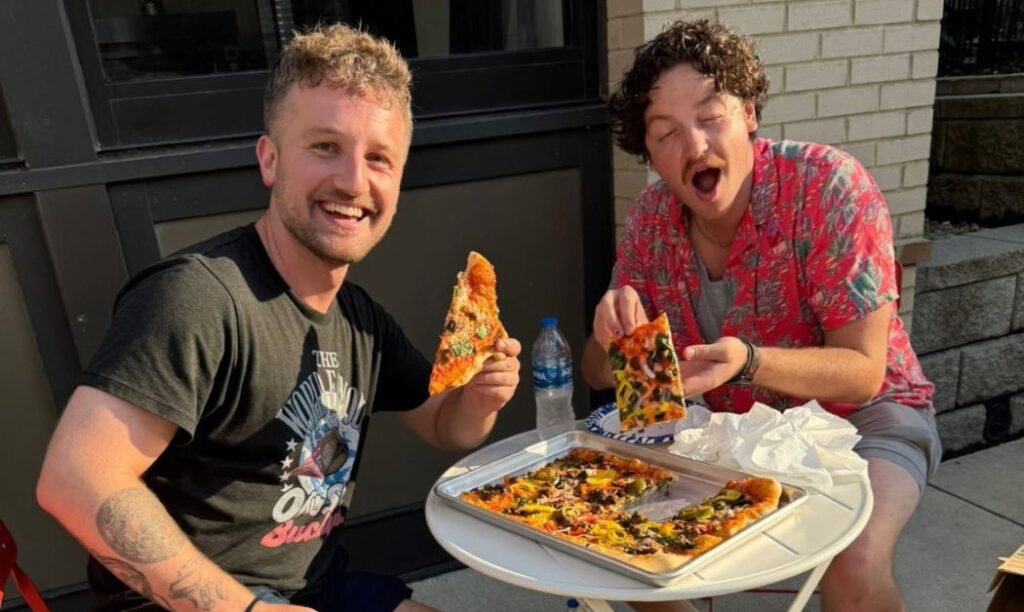Joey from Step Out Columbus and his friend Will enjoying their first experience at Artisan Pizza Cafe.