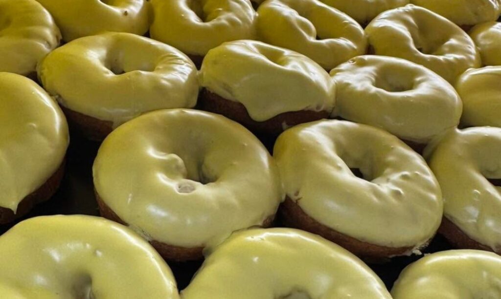 Freshly glazed cake donuts from Donalds Donuts