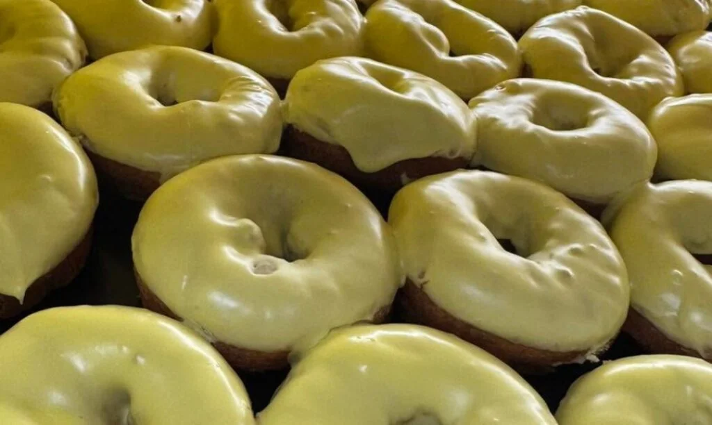 Freshly glazed cake donuts from Donalds Donuts