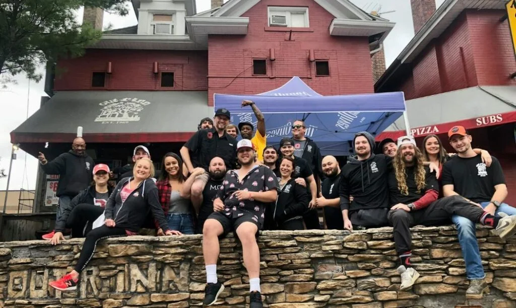 The employees at Out-R-Inn pose out front.