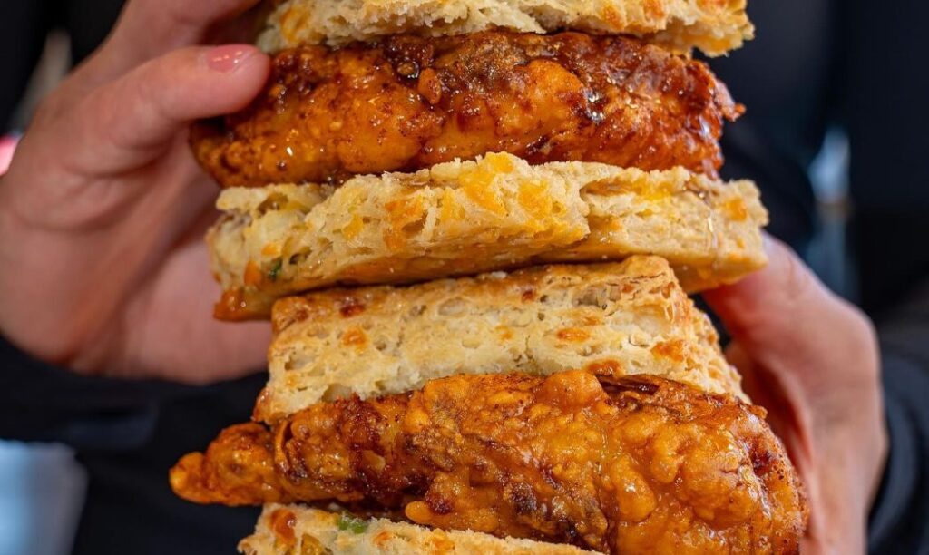 Two chicken sandwich biscuits stacked atop one another