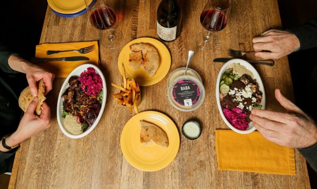 Two people sharing a meal at Brassica