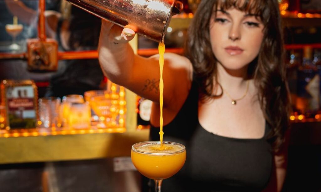 A bartender pours a drink at The Marmont in Columbus, OH