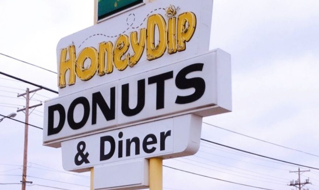 The sign on Kenny Road in front of Honey Dip Donuts & Diner