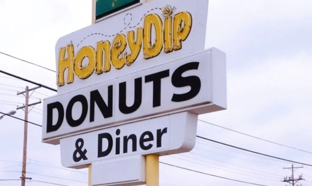 The sign on Kenny Road in front of Honey Dip Donuts & Diner