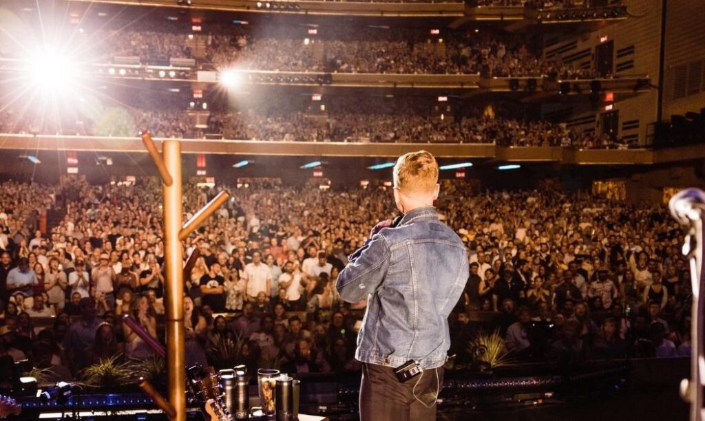 Tyler Childers performing in front of a sold-out theater. 