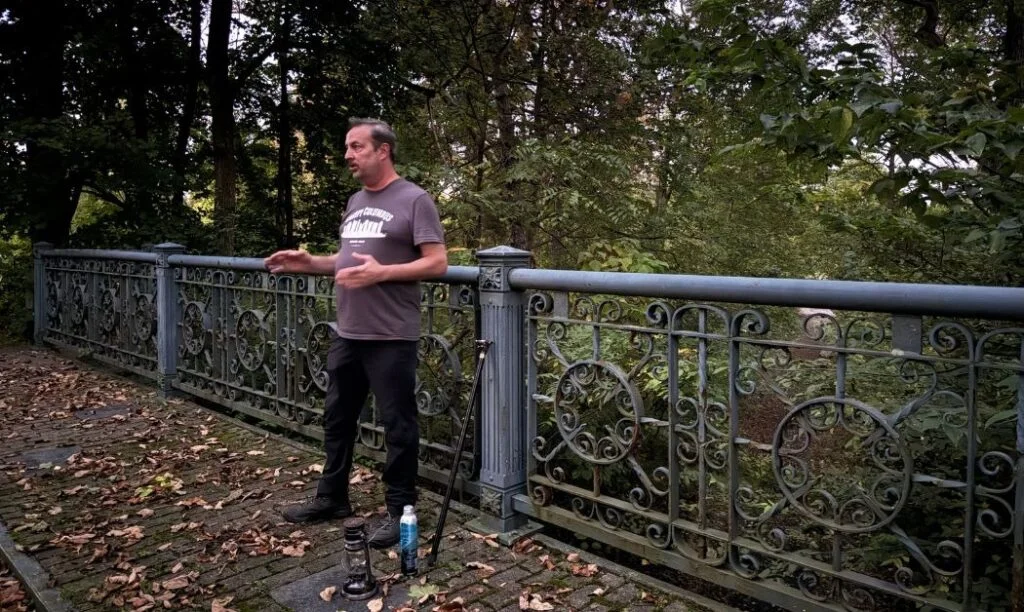 E.R. "Bucky" Cutright from Columbus Ghost Tours tells a story from the bridge at Green Lawn Cemetery in Columbus, Ohio.