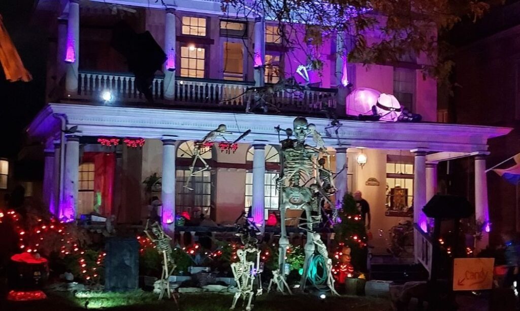 A home on Bryden Road in Olde Towne East shows off their Halloween spirit with a giant skeleton, purple and orange lighting, tombstones, and more.