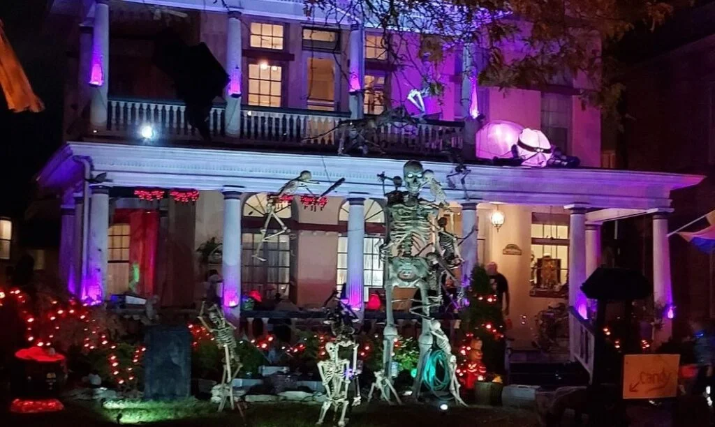 A home on Bryden Road in Olde Towne East shows off their Halloween spirit with a giant skeleton, purple and orange lighting, tombstones, and more.